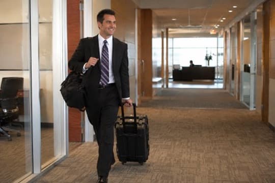 Legal videographer arriving at a proceeding with a rolling equipment case