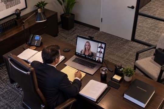 Attorney participating in a remote deposition from a professional office
