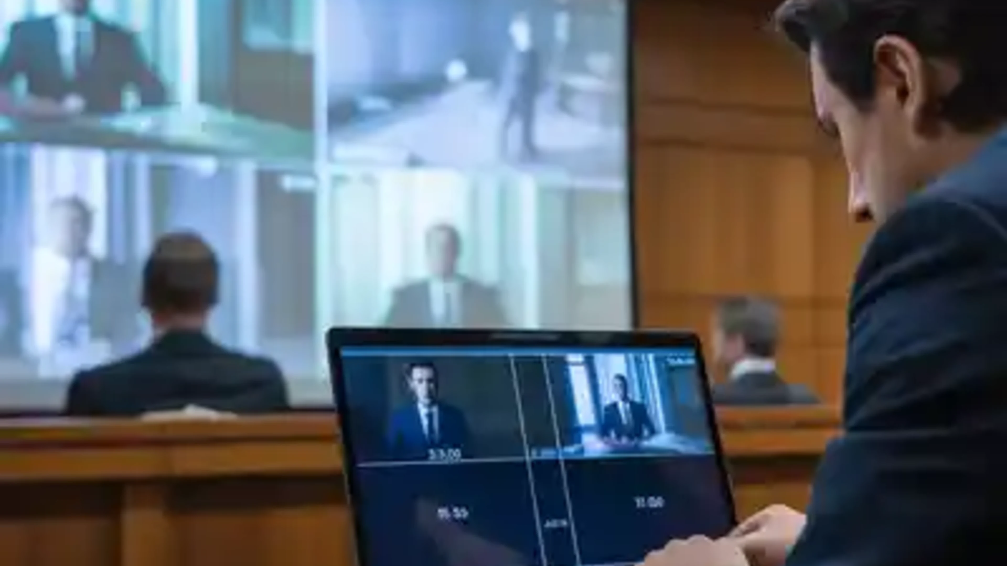 Legal professional managing courtroom video playback from a laptop