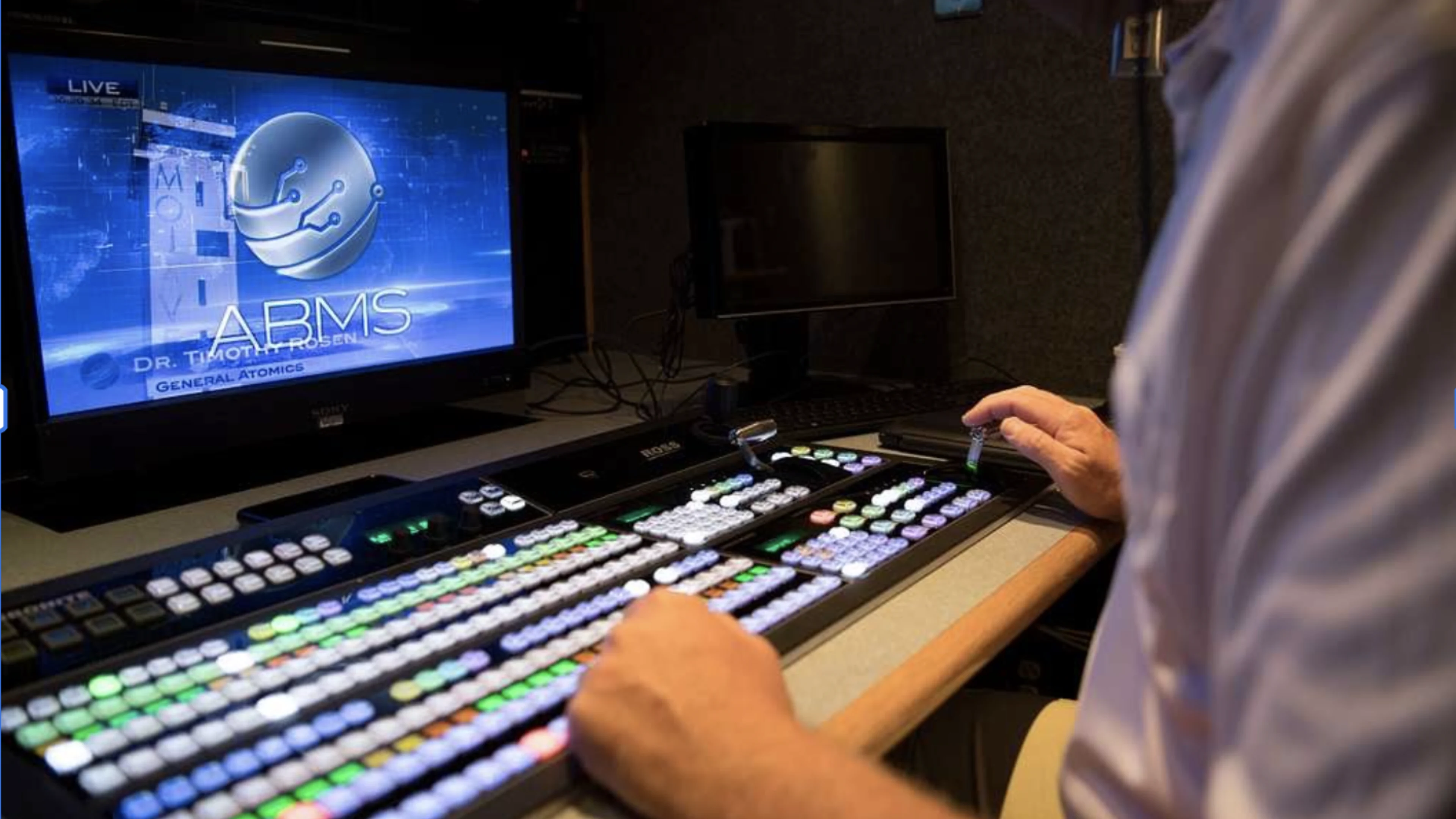 Video technician operating a live switching console