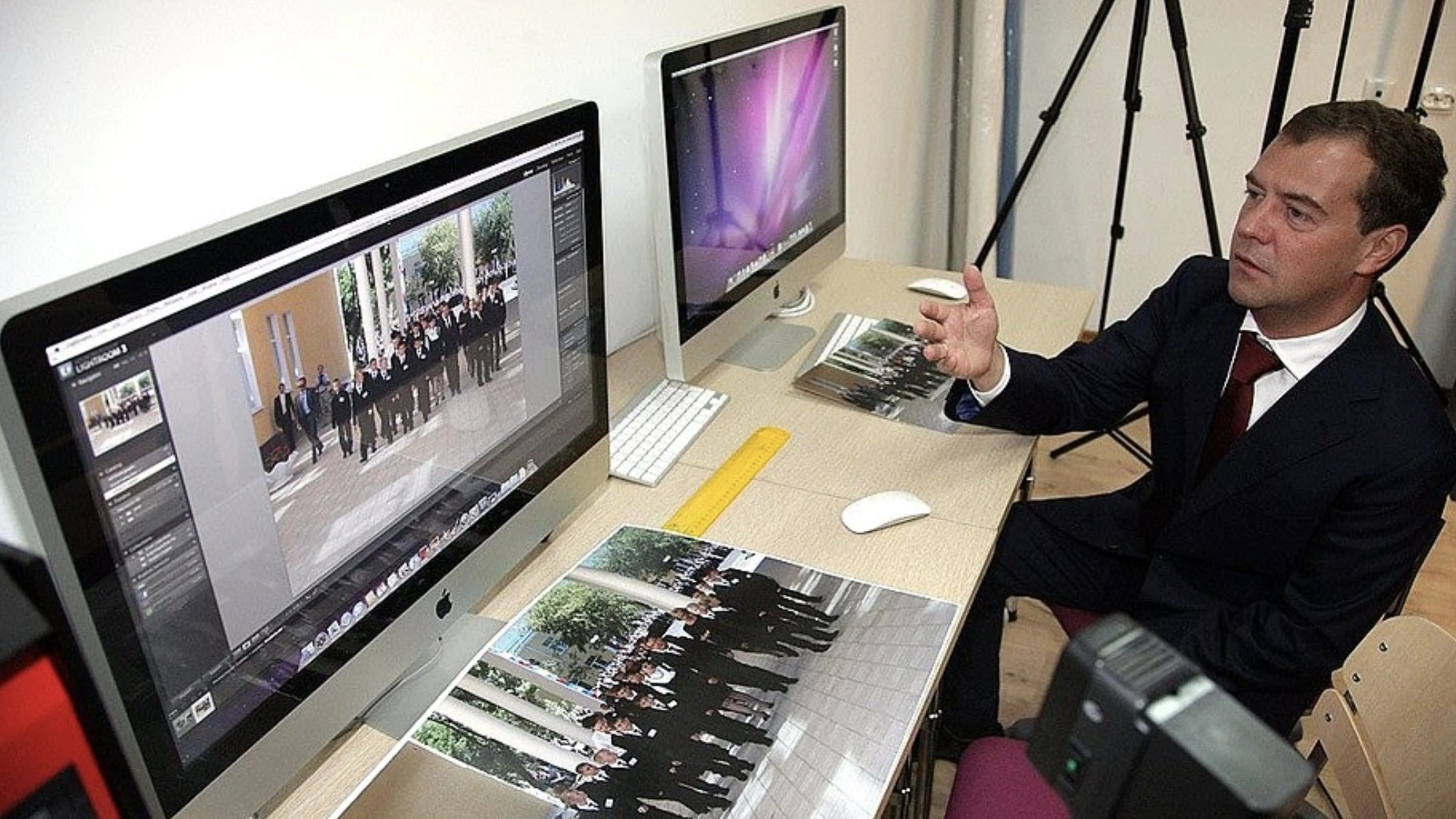 A legal professional reviewing source imagery at an editing workstation